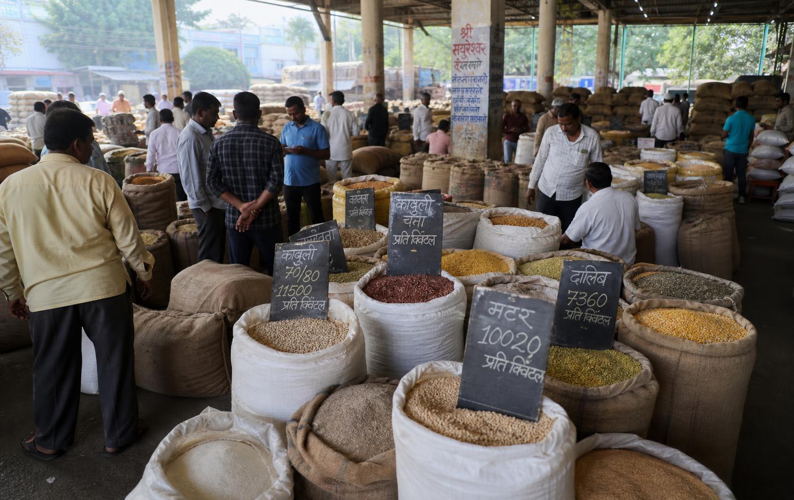 Busy Vashi APMC wholesale mandi with sacks of grains and pulses
